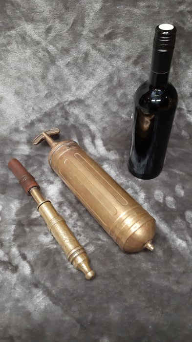 Pyrene - Antique fire extinguisher and an old fire hose spray - Brass