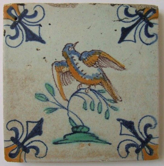 Farbige Fliese mit einem Vogel mit französischen Lilienecken. - Töpferware