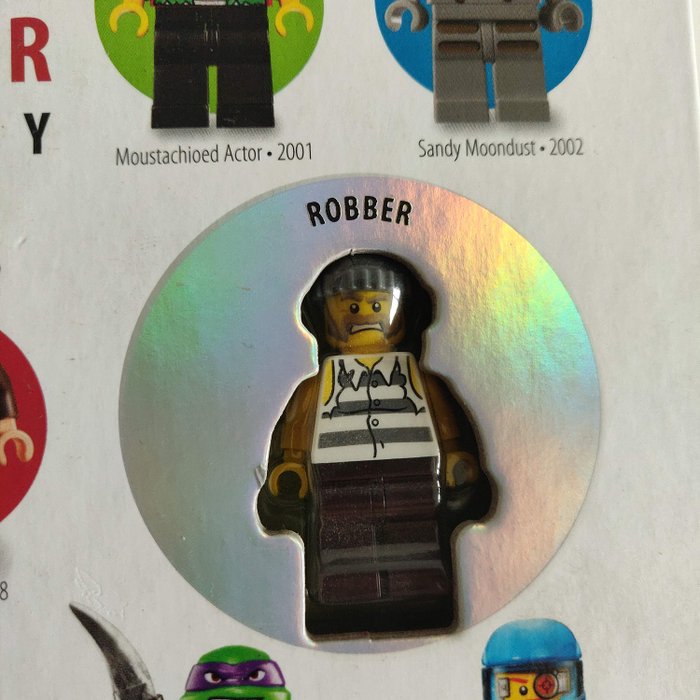 LEGO MINIFIGURE YEAR BY YEAR A VISUAL HISTORY W// TOWNSPERSON ROBBER STORMTROOPER
