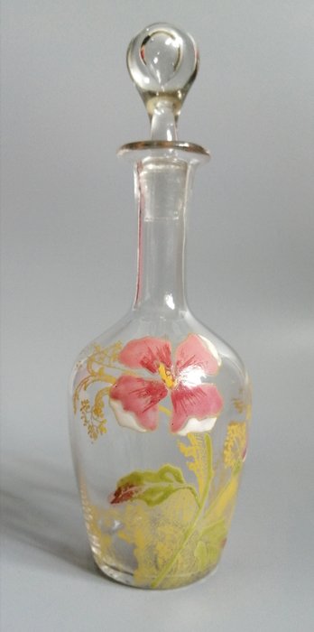 Art Nouveau carafe in enamelled glass decorated with flowers.