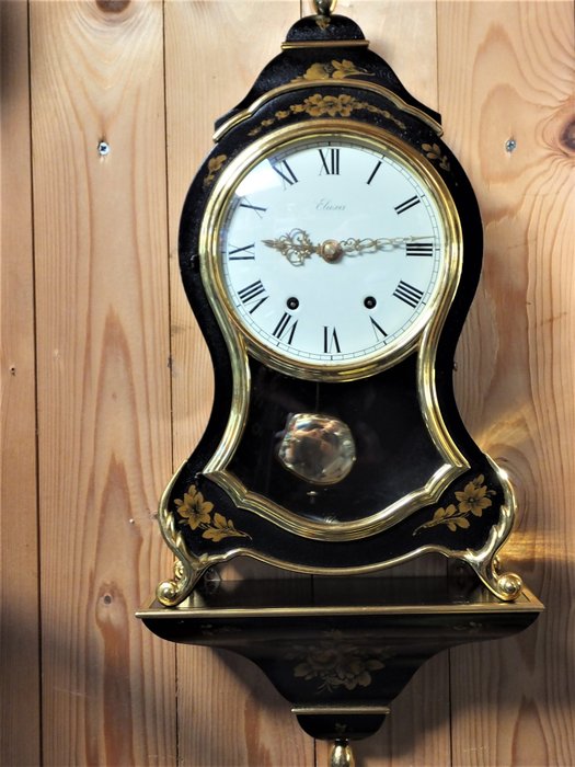 Relógio da cornija de lareira de Eluxa Neuchatel com console em condições bonitas. - Eluxa - Esmalte, Latão, Madeira, Resina / Poliéster - Segunda metade do século XX