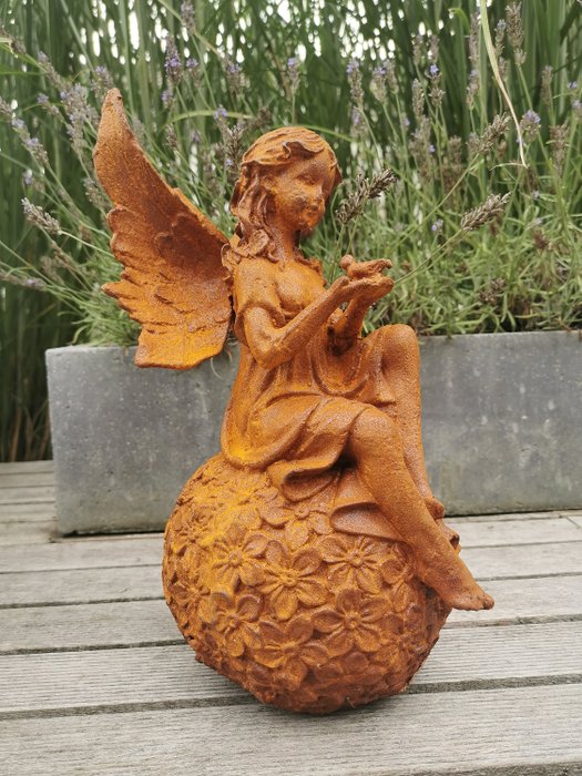Figurine - A rustical Fairy on sphere - Gusseisen