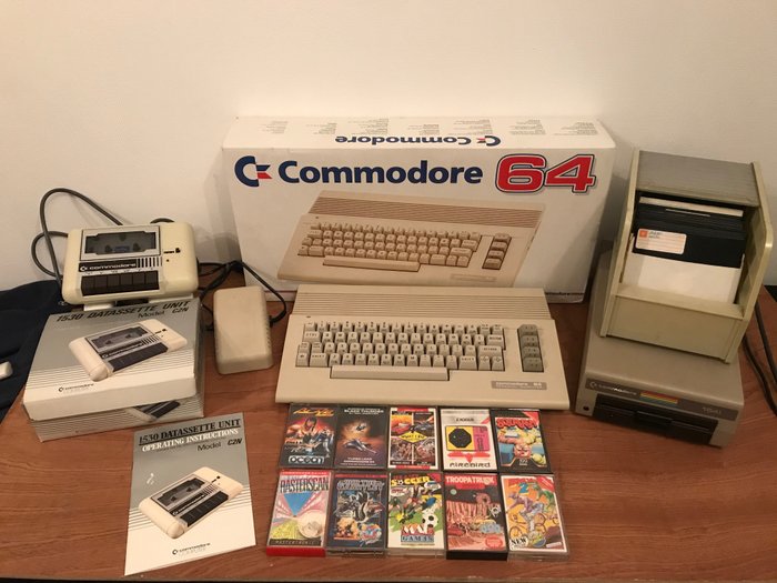 Commodore - 64 mint in box 1984 with 10 game cassettes and 75 floppys