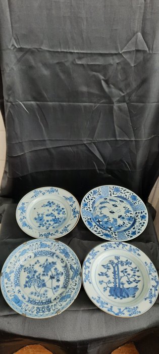 Plates (4) - Blue and white - Porcelain - butterflies, trees, birds, flowers, lotuses - China - Kangxi (1662-1722)