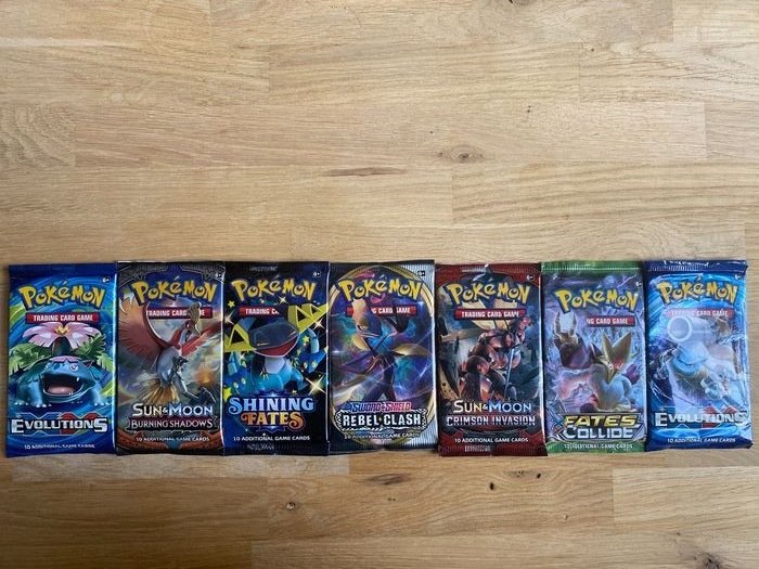 The Pokémon Company - Booster Pack 2 Evolutions Boosters + 5 Different Set Boosters