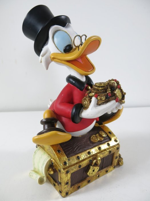 Donald Duck - Disney - beeld Dagobert Duck op geldkist (27 cm)