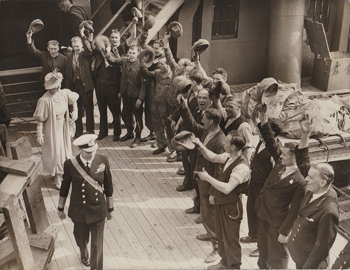 Wide World Photos - Workmen cheer King George VI and Queen Elizabeth at London docks, 1939