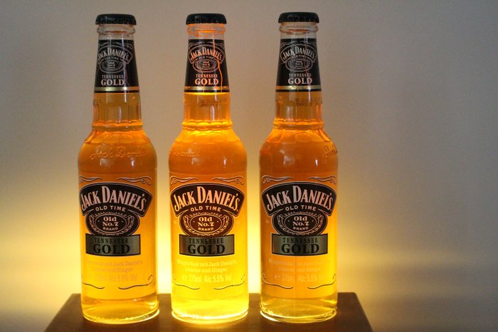 Jack Daniel’s Tennessee Gold, German version, spirit drink on display with lighting – Original bottling – 275ml – 3 flessen