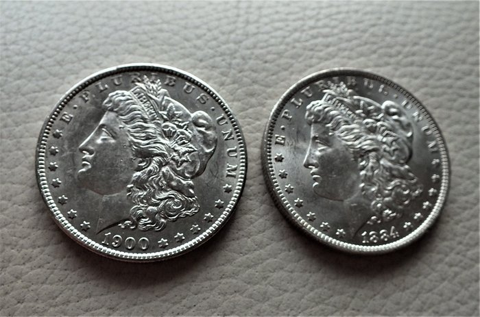 United States. 2 Coins - Morgan Dollar 1884 O - New Orleans & 1900 - Philadelphia