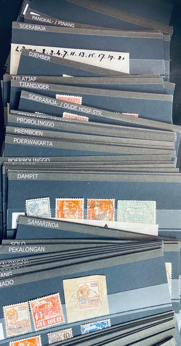 Niederländisch-Indien - A collection of cancellations by place name including Papua on cards and in bags
