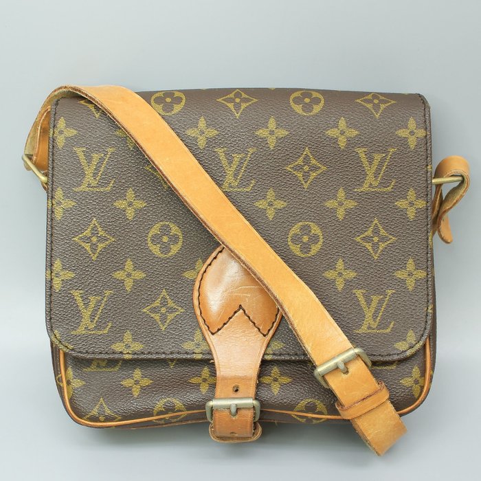 At Auction: Louis Vuitton, LOUIS VUITTON CARTOUCHIERE SHOULDER BAG