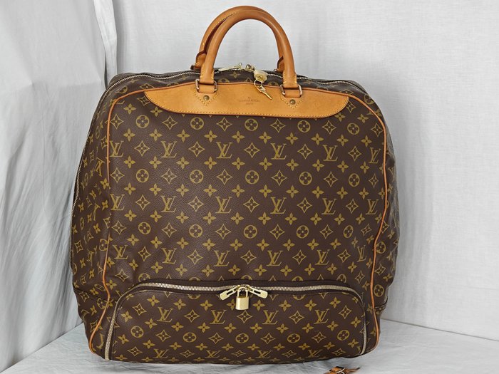 Sold at Auction: Louis Vuitton Evasion Monogram Travel Bag