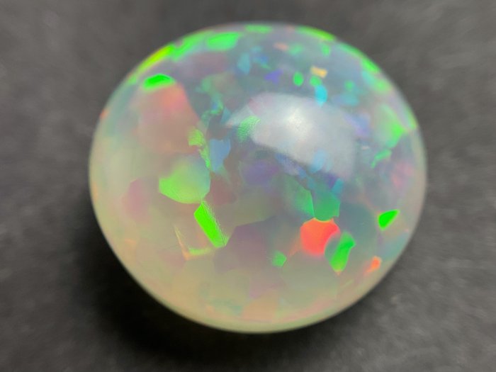 Giallo grigiastro chiaro + Gioco di colori (vivace) Opale di cristallo - 11.40 ct