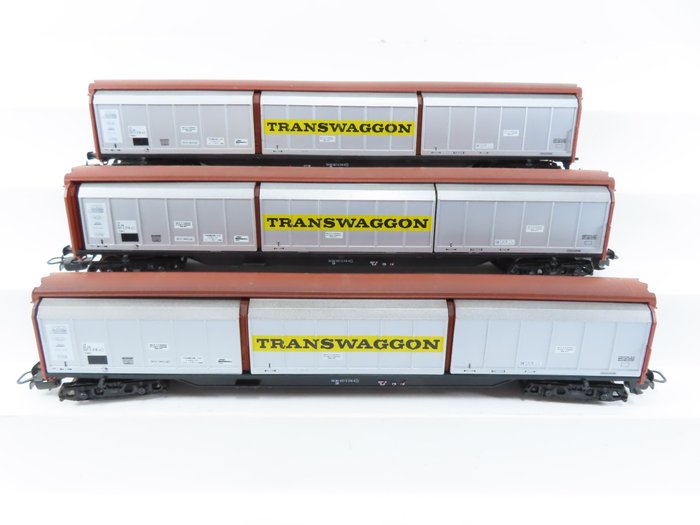 Preview of the first image of Electrotren H0 - 5512 - Freight carriage - 3x 4-axle sliding wall wagons with "Transwaggon" imprint.