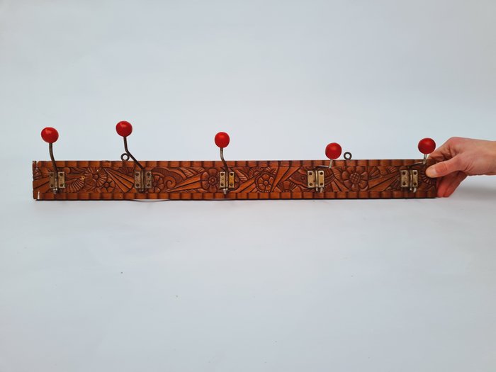 Preview of the first image of Wall coat rack in wood, with motifs from the Art Nouveau period..