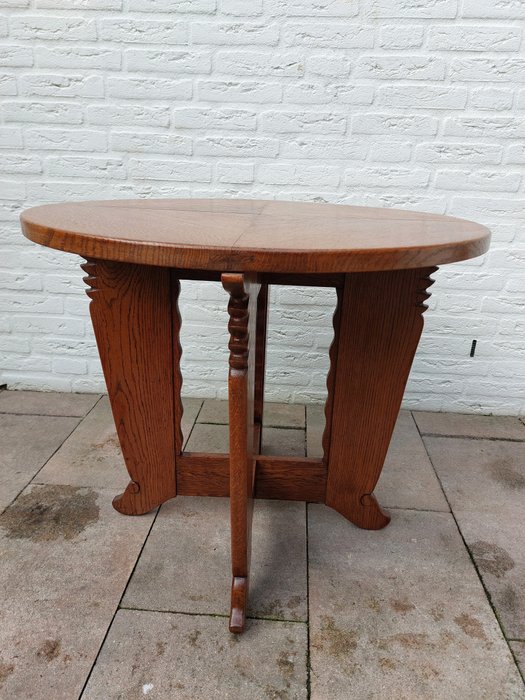 Preview of the first image of A round wooden table with a separate glass top.