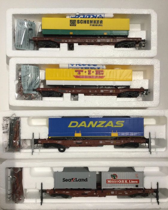 Preview of the first image of Roco H0 - 46378/46373/46362/46356 - Freight carriage - 1 container and 3 trailer waggons - DB.
