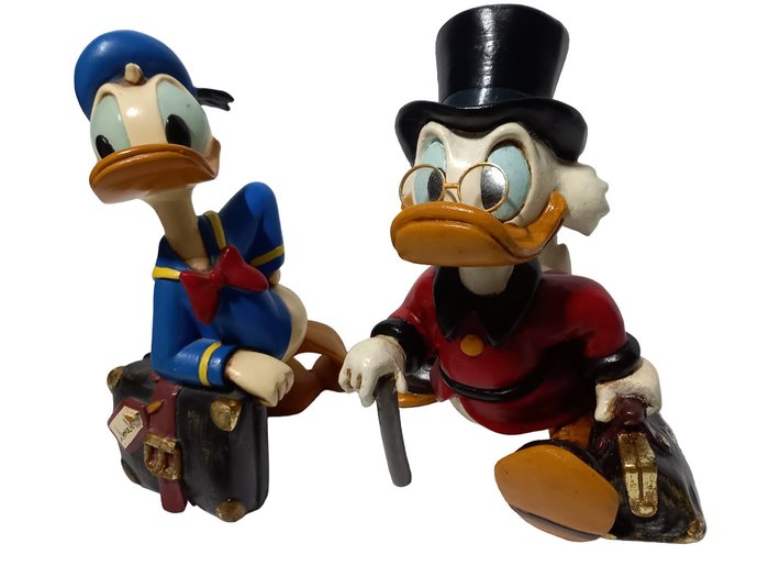 Preview of the first image of Uncle Scrooge with a bag full of money and Donald Duck with a traveling suitcase (25 cm) - ca. 1990.