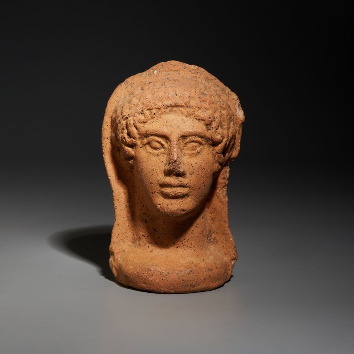 Etrusca Barro/Cerâmica Oferenda votiva em formato de rosto. Século 4 aC. 10,5 cm de altura
