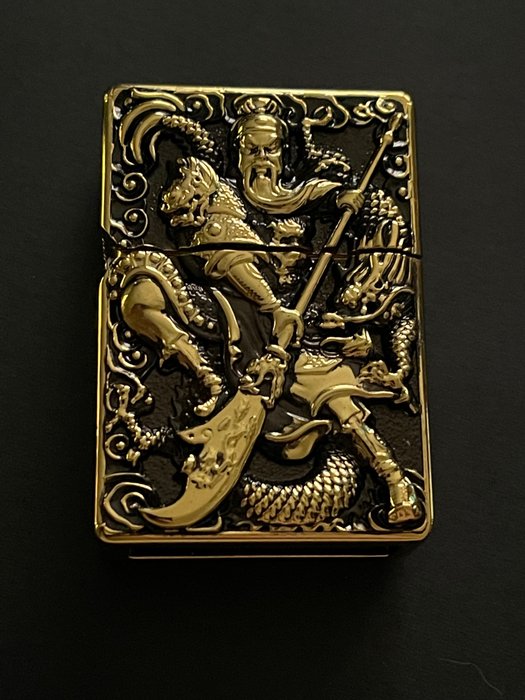 Zippo - Quan Kong - Pocket lighter - Brass, Bronze (gilt/silvered/patinated/cold painted), Steel (stainless)