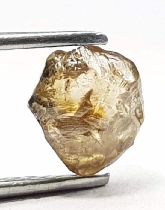 Ljusbrun rå naturlig diamant. 1,51 karat. Rått, oklippt- 0.3 g