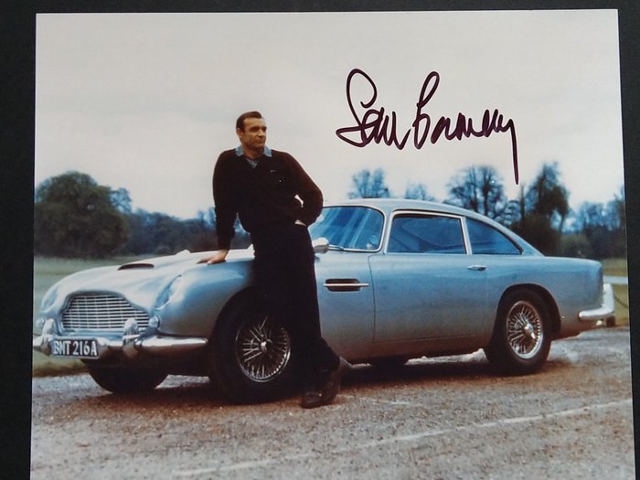 James Bond 007: Goldfinger - Sean Connery (+) with his Aston Martin DB5 - Autograph, Photo with COA