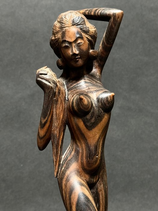 Woodcarving of a naked Balinese woman - Indonesia