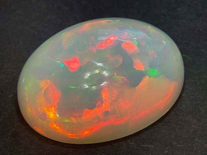light orange with opalescent rainbow colors Natural opal - 18.83 ct