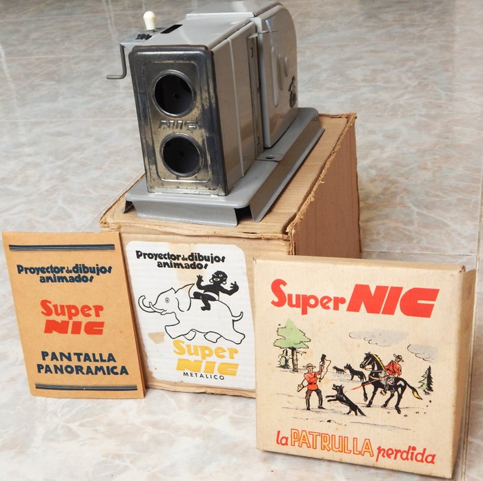 Super NIC Proyector metálico de dibujos animados en caja original + serie 1 del Oeste (6 películas) Filmprojektor