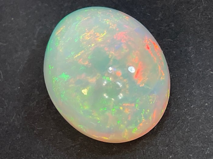 Fine Color Quality + White (orangy) + Play of Color (Vivid) Crystal Opal - 6.42 ct