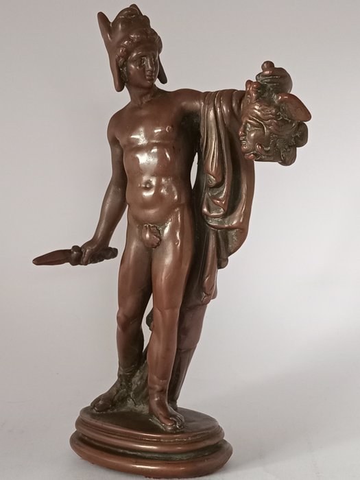 Figure - A filled bronze patinated statue of Perseus holding Medusa head after Cavona.