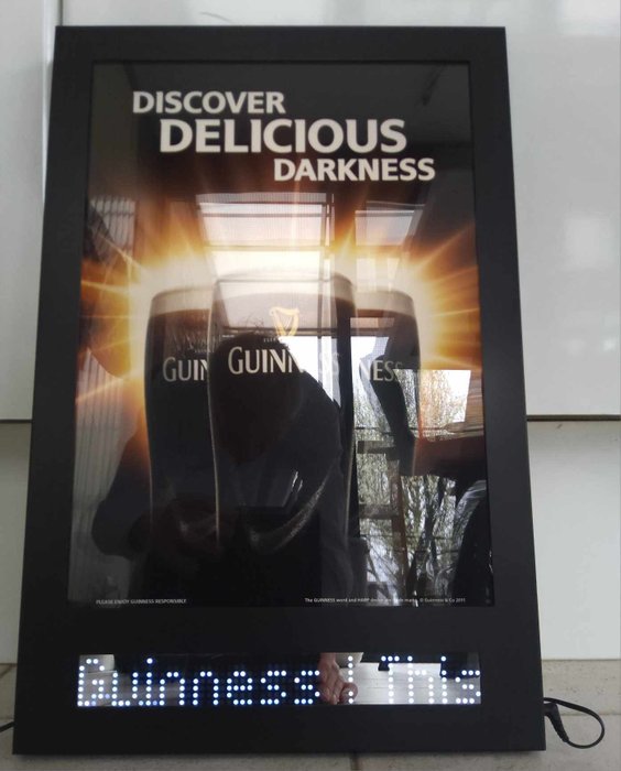 Guinness - Mainosrulla ilmaisella kellolla - 55 x 36 x 3,5 cm pullojen
