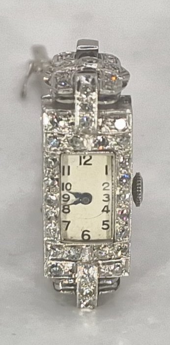 SWISS - Platin Schmuckarmbanduhr  - Platinband - Diamantenbesatz 148 Steine - Formwerk - Senhora - Suíça por volta de 1925