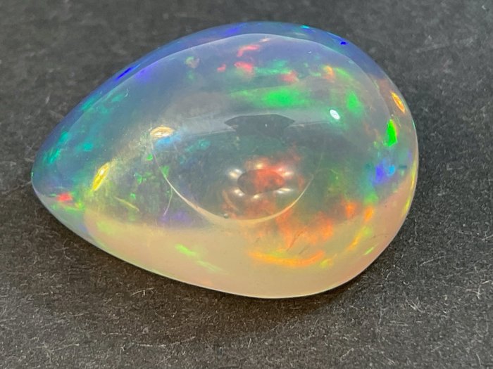 light Blue (orangy) + Play of Colors Crystal Opal - 7.58 ct