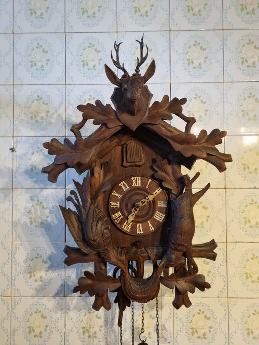 Horloge murale - bois, os, fer forgé, laiton. - 1900-1920