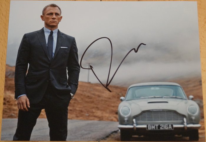 James Bond 007: Skyfall - Daniel Craig as 007 with Aston Martin DB5 - autograph, photo, signed with Certified Genuine b´bc holographic COA
