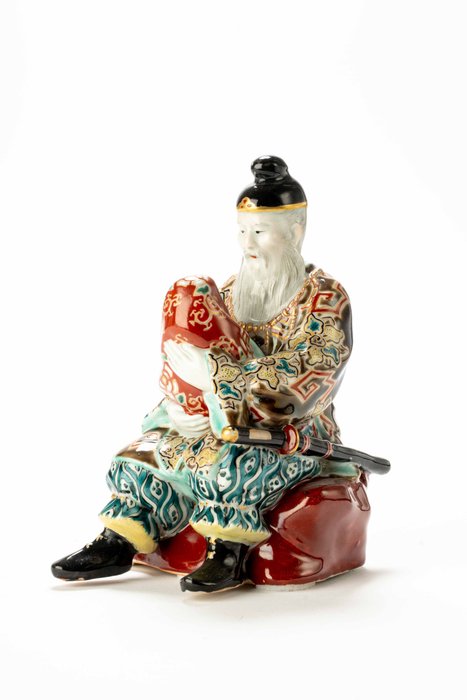 An inusual kutani porcellain okimono of a man with child - Ceramica, Oro, Smalto - Giappone - Periodo Taishō (1912-1926)