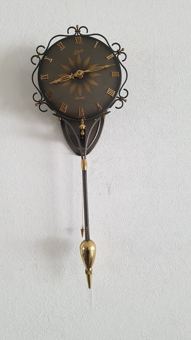 Schwingende Mystery Clock - SCHATS Mid-century modern Stahl - 1960-1970