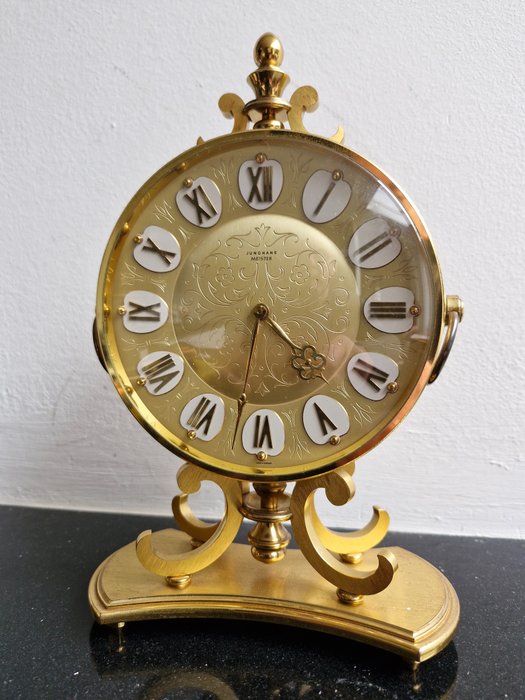 Horloge de table - Junghans -   bronze doré, laiton, verre, - 1950-1960