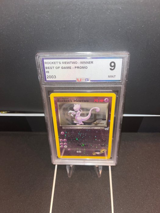 Wizards of The Coast - 1 Graded card - ROCKET'S MEWTWO - WINNER ( STAMPED ) - UCG 9