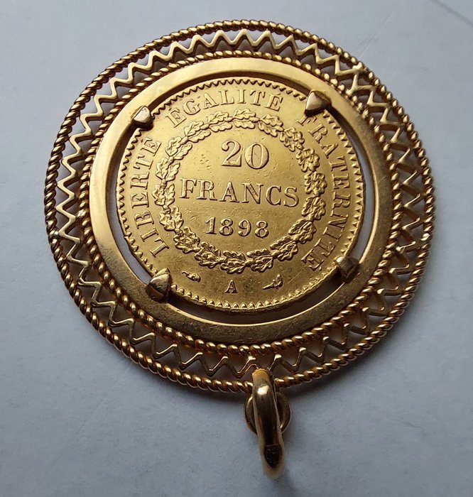 Frankrike. 1898, 21,6 karaats gouden munt (20 Francs-Génie) met zetting van 18 karaat goud