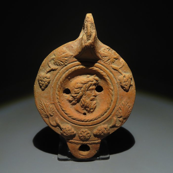 古羅馬 Terracotta 附有宙斯頭的油燈。西元一世紀至四世紀。 11 公分長。