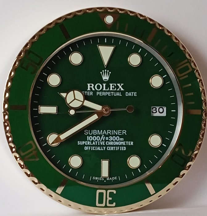 Wanduhr - Konzessionär Rolex Submariner Display Uhr - Aluminium, Glas - 2020 und ff.